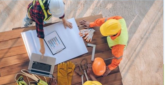 Team validating post-implementation performance data and savings on site