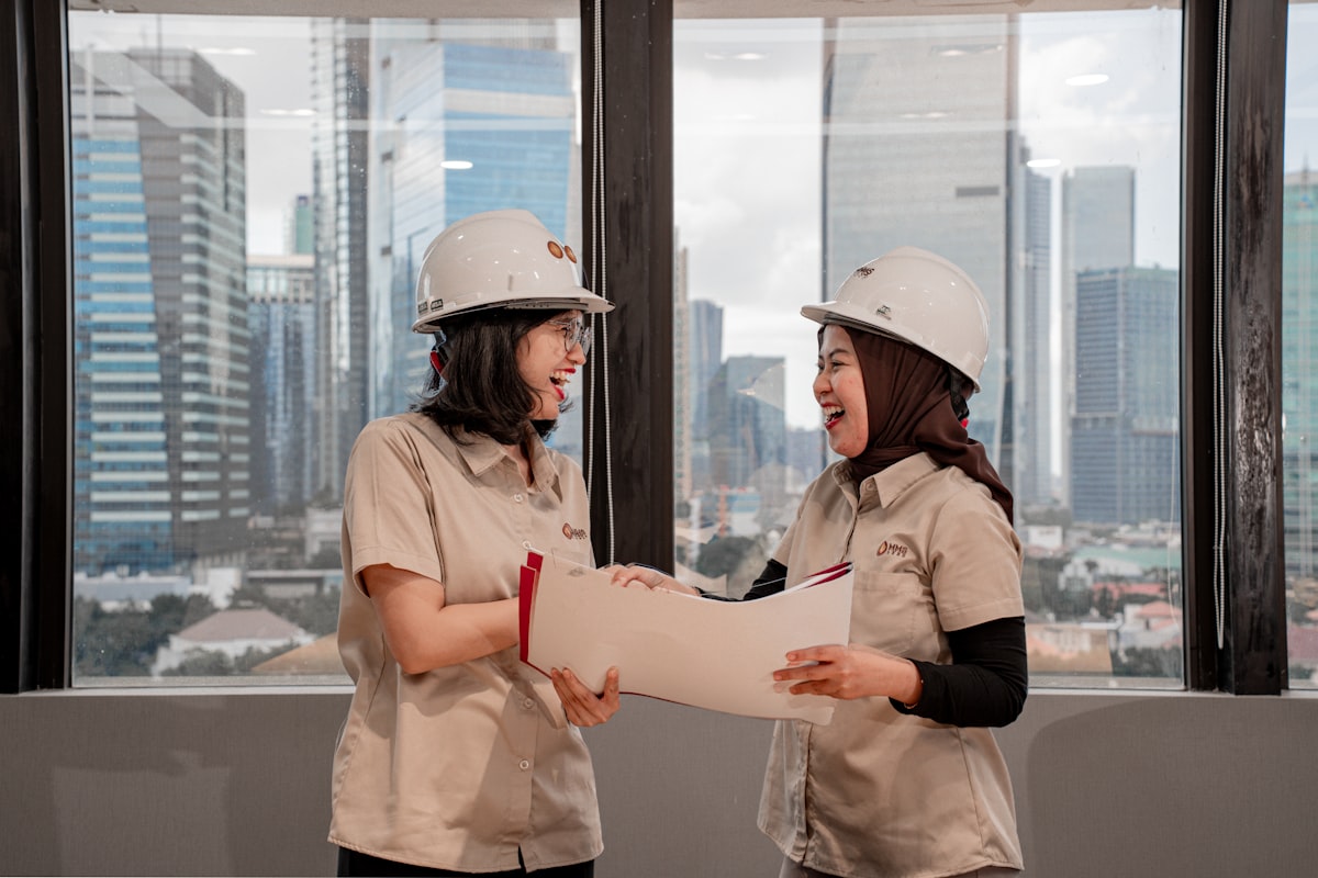Two engineers reviewing a technical drawing together