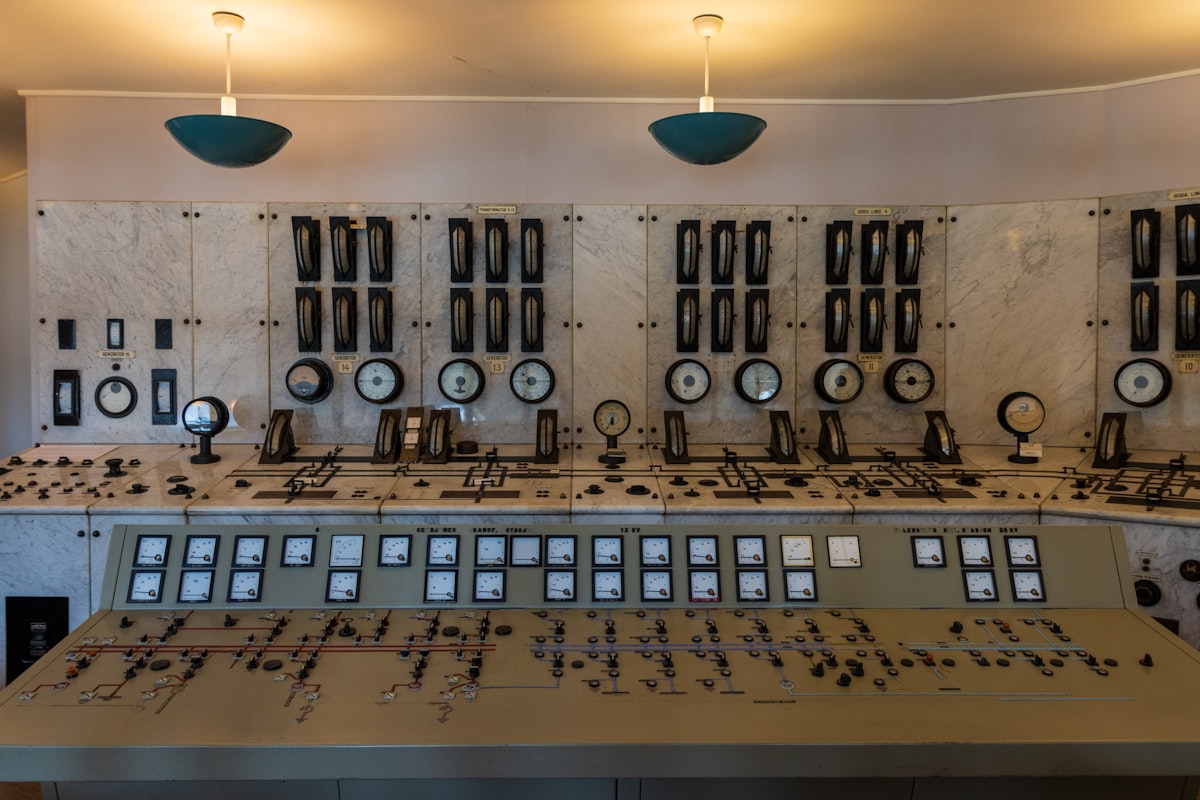 Industrial control room panel with analog gauges